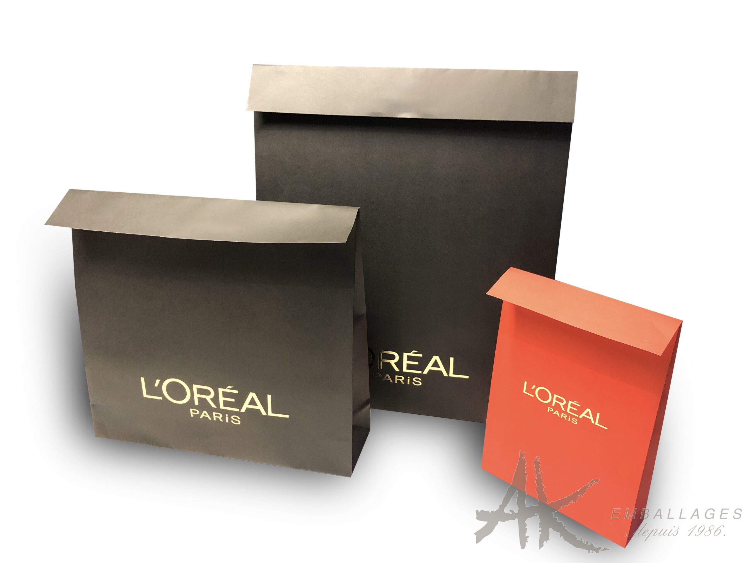 pochettes papier cadeaux sur mesure trois pochettes cadeaux logo or à chaud L OREAL