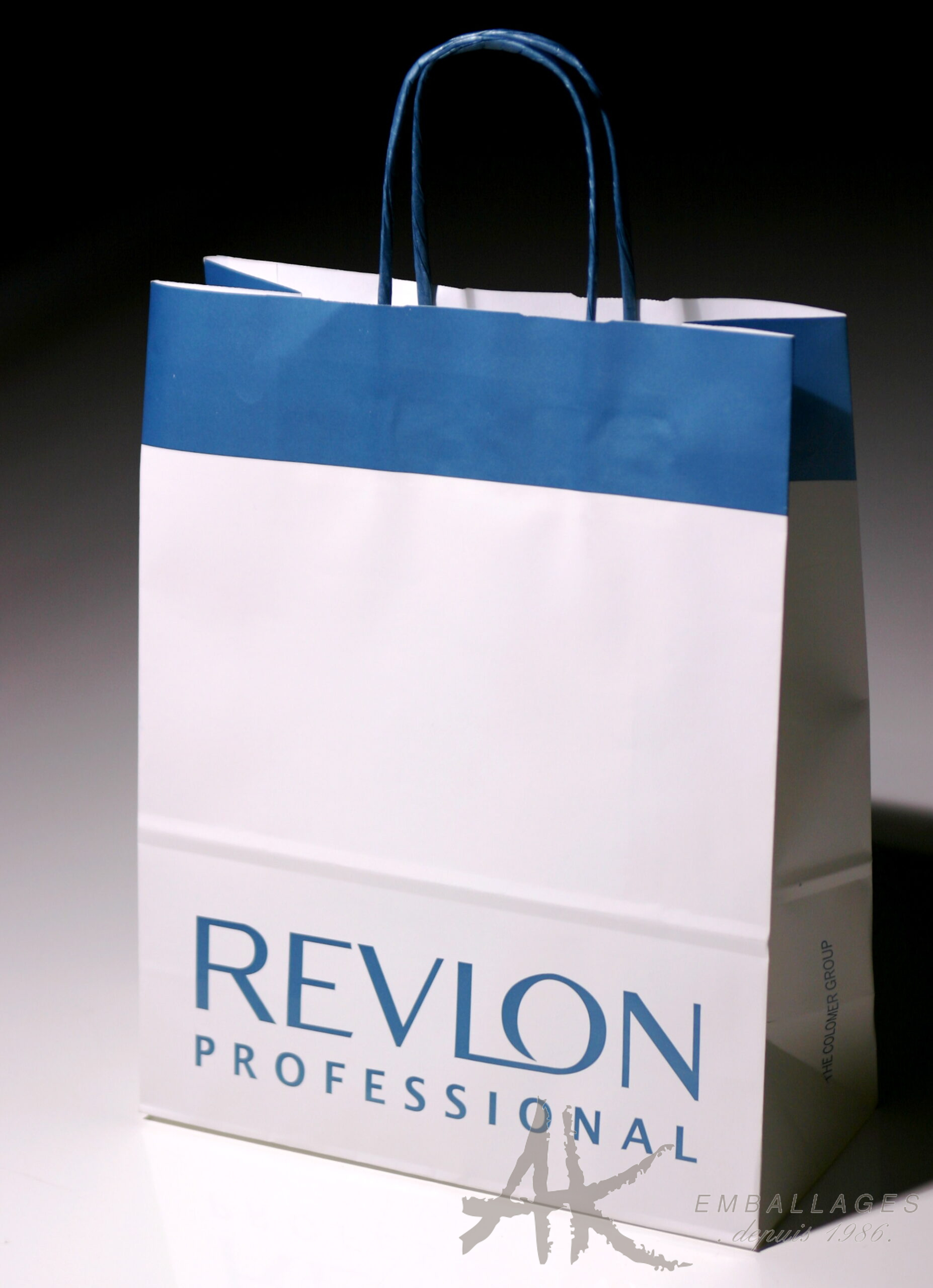 sac papier publicitaire sac papier poignée torsadée - REVLON logo